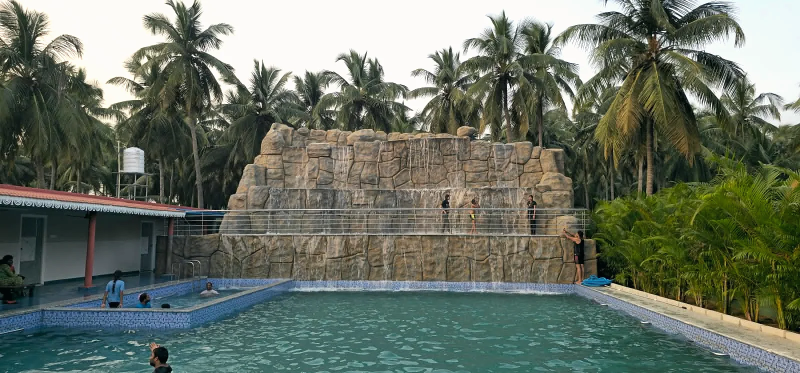 Families and children enjoying the pool and waterfall during the Dussehra holidays
