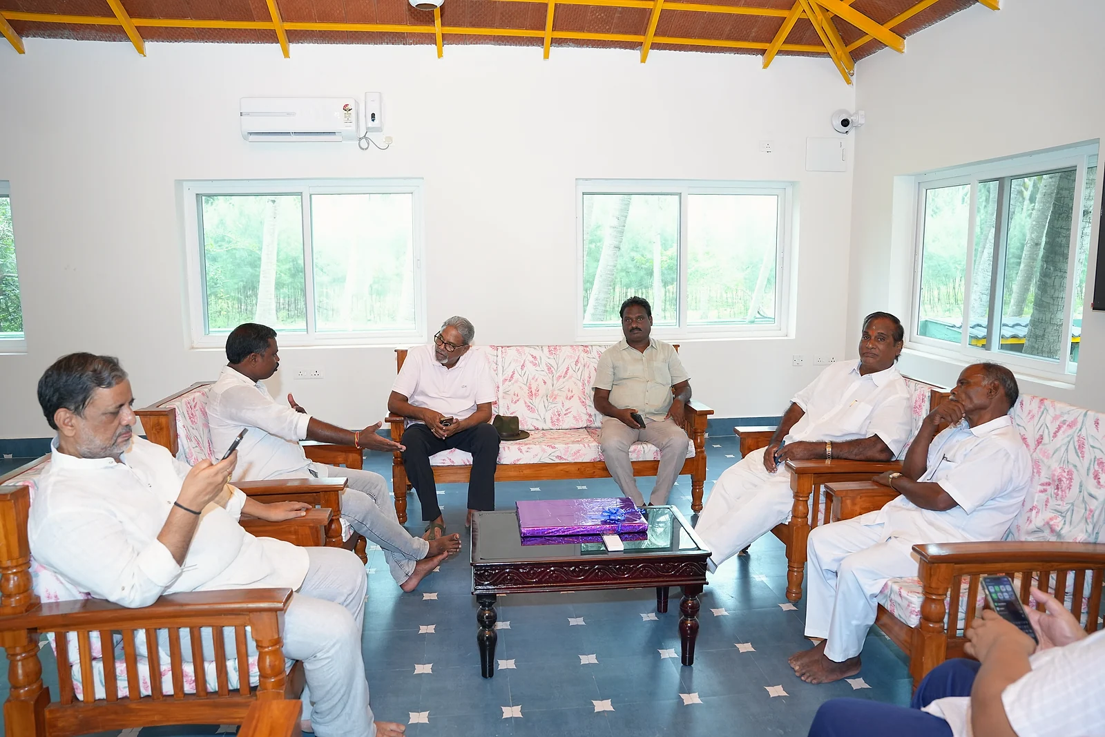 Guests relaxing and chatting in the resort lounge during the launch