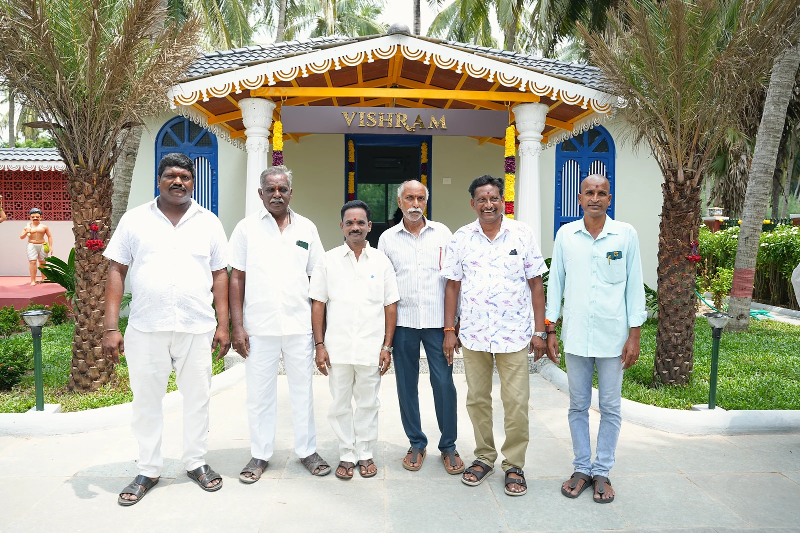 Guests posing together outside Vishram during the launch celebrations
