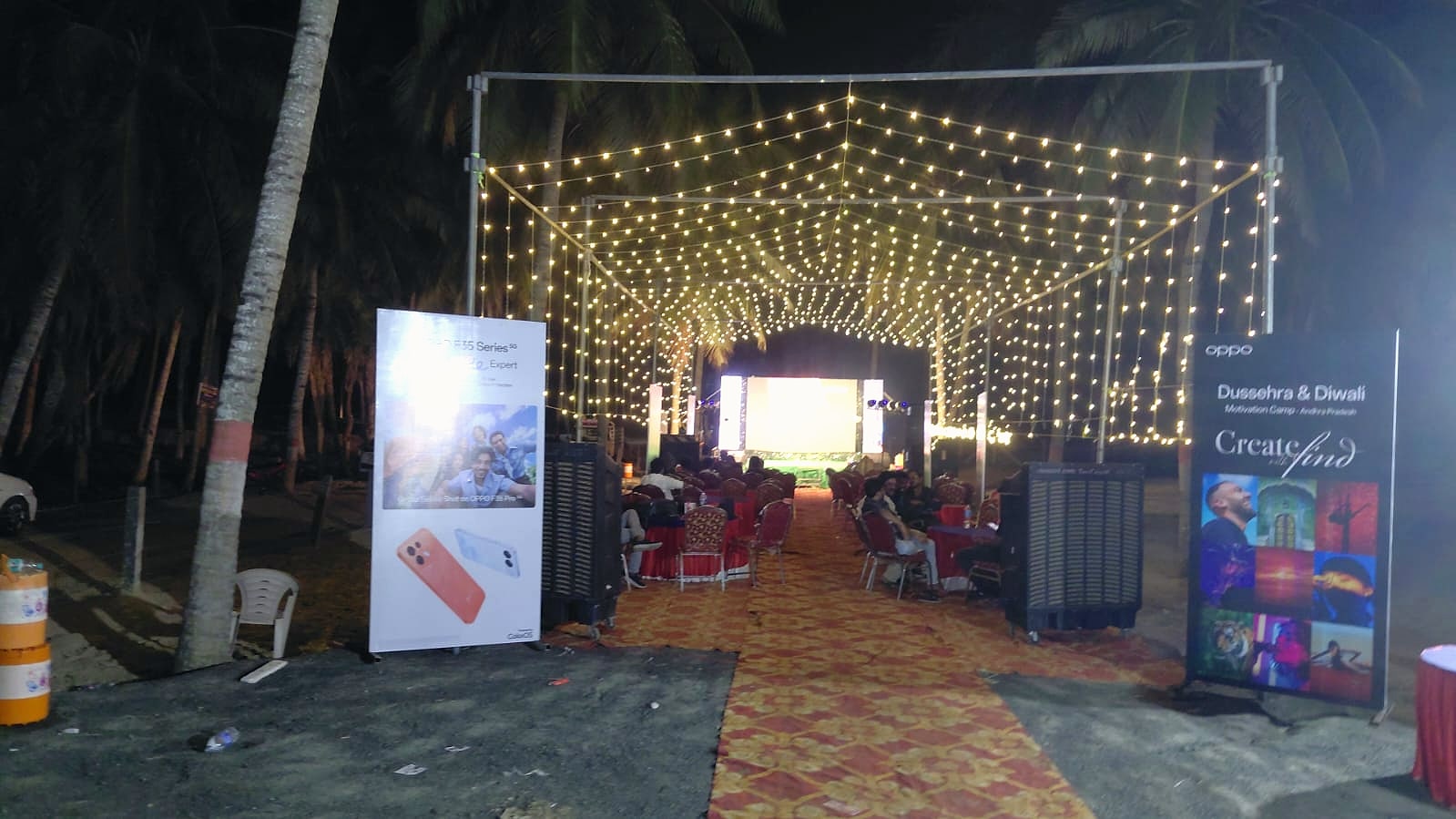 OPPO Dealers Event entrance with a canopy of warm string lights at The Palem Retreat